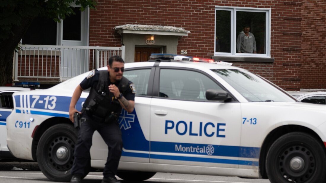 Eine Person schaut aus dem Fenster, während die Polizei zu einer Schießerei im Stadtteil Côte-des-Neiges in Montreal ausrückt. Foto: Christopher Katsarov/The Canadian Press/AP/dpa 20260623134333038.jpg